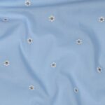 Katoen voile broderie minimadeliefjes licht jeans