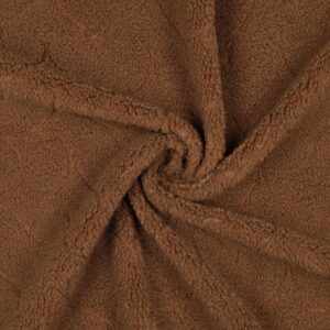 Bruine teddy stof met zachte pluche textuur in close-up detail