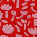 Coupon 20cm Organische tricot abstracte bloemen oranje X Jennifer Bouron